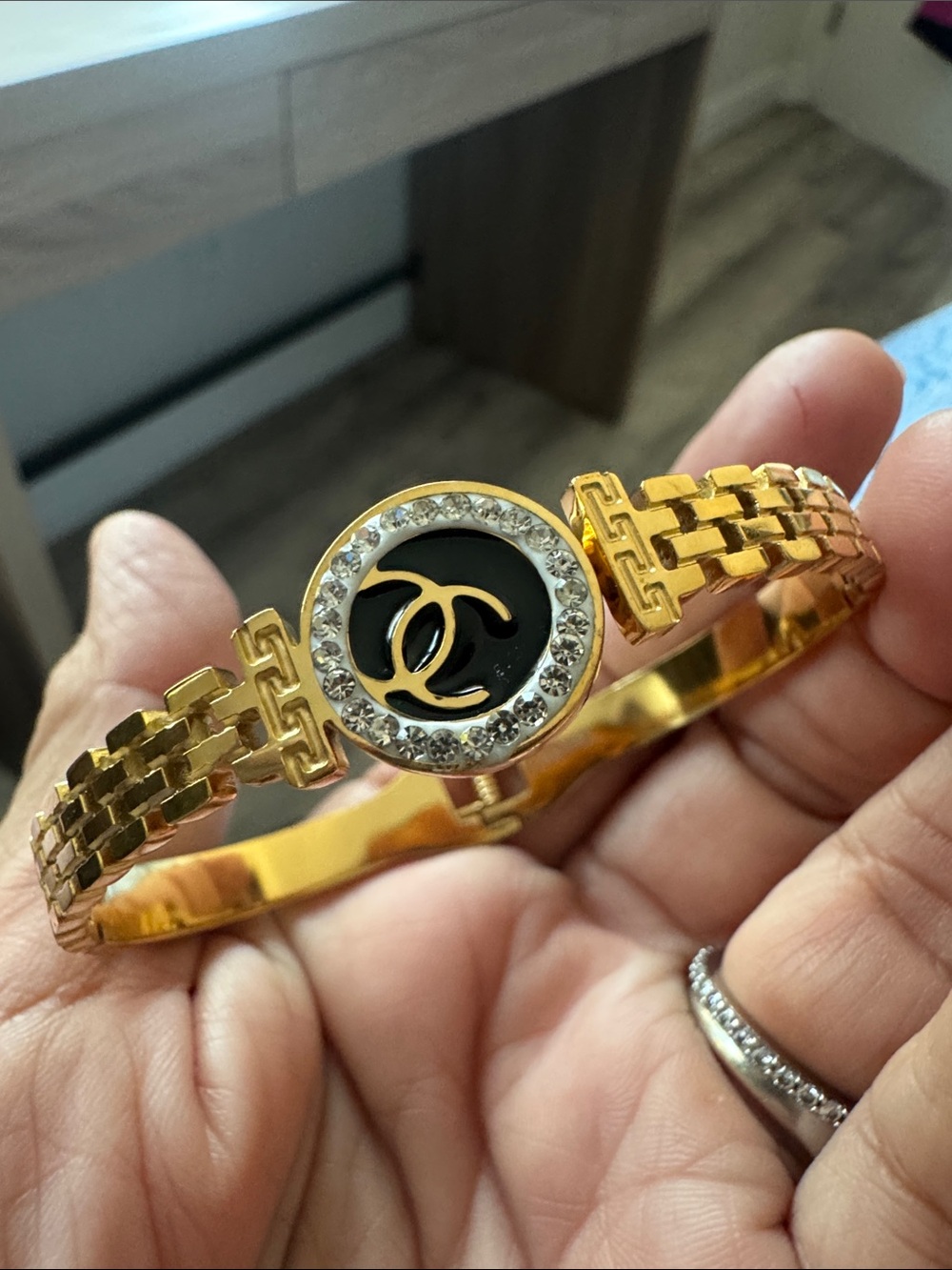 Gold-Tone Black Medallion Bracelet with Crystal Accent